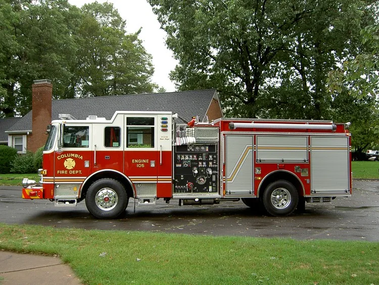 Driver-side profile view showing pump panel area and side compartments