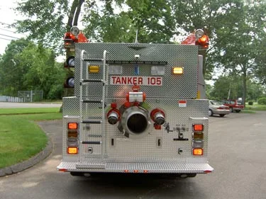Rear view showing large intake, rear panel fittings, and warning lights