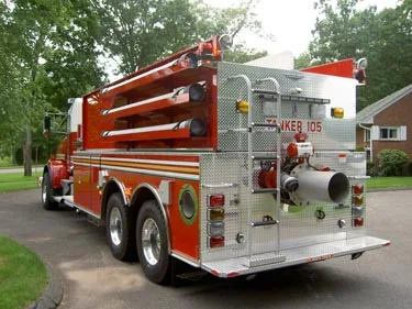 Rear-right exterior view showing rear panel, side tank body, and wheel area