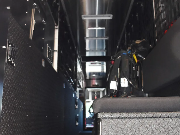 Interior body corridor view showing long aisle and ceiling lighting