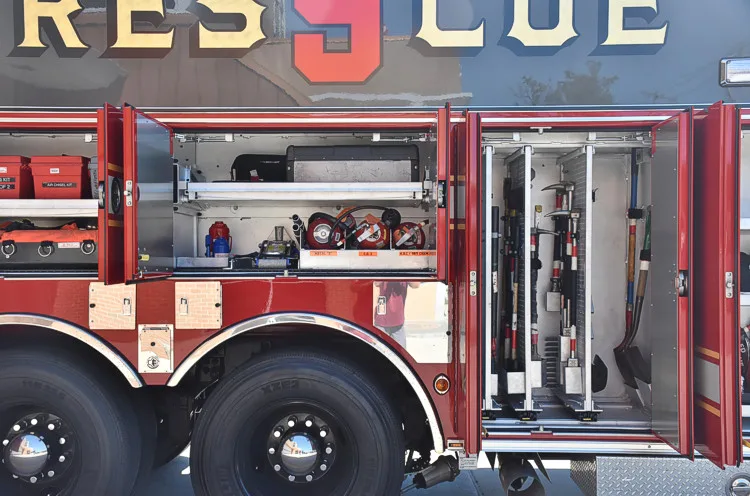 Side body close-up showing large raised unit lettering over compartments