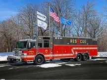 Heavy rescue truck front-left exterior view showing full side body