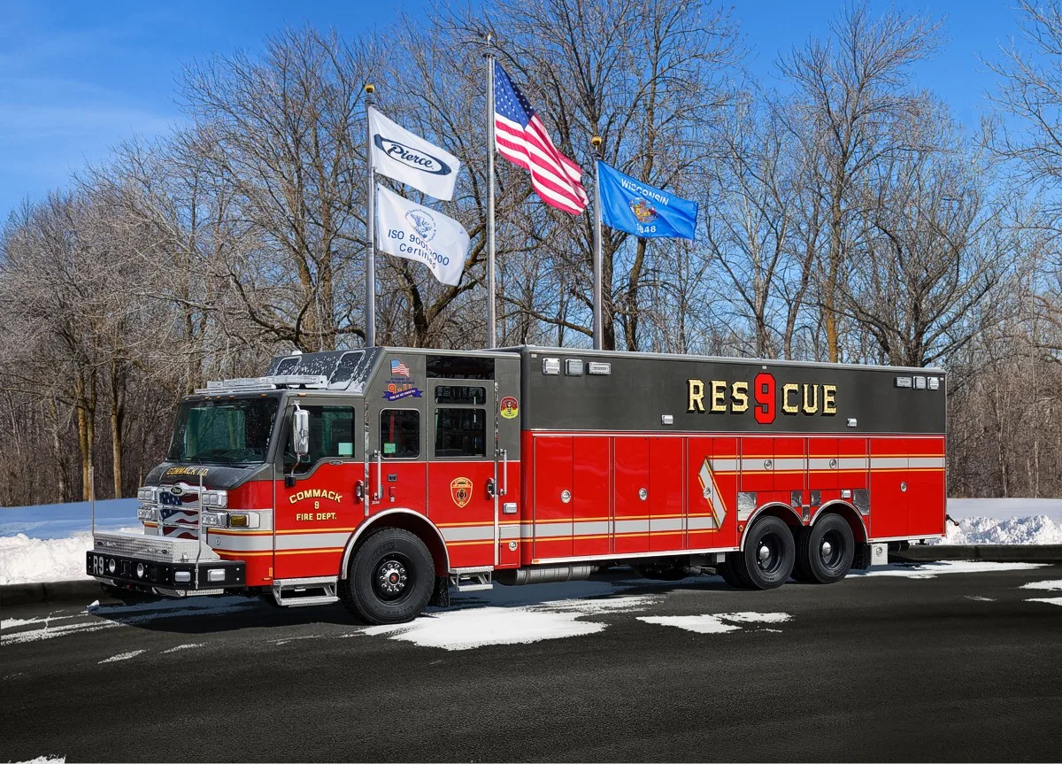 Heavy rescue truck front-left exterior view showing cab and tandem rear section