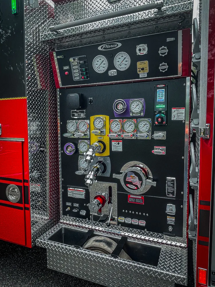 Pump panel close-up showing gauges, valves, and labeled controls