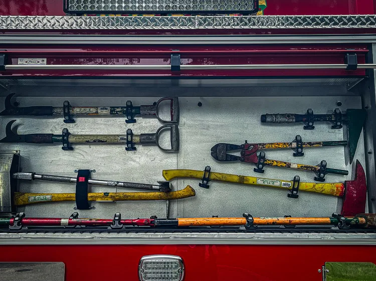 Open side toolboard compartment showing mounted hand tools in rows