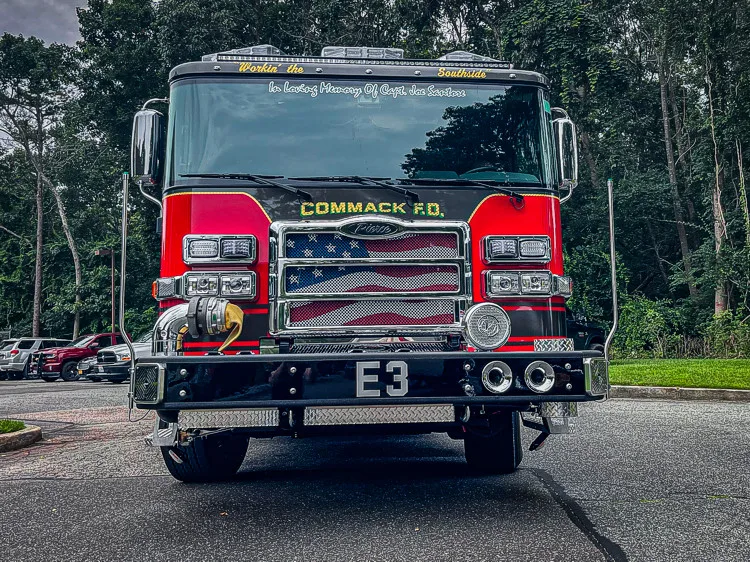 Head-on front view showing grille, bumper intake, and warning lights
