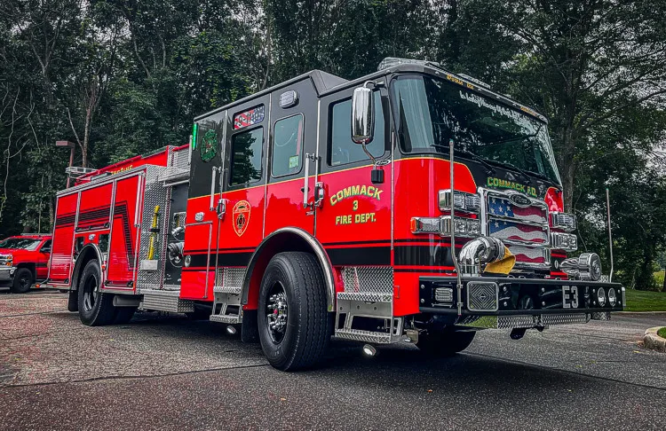 Pumper rear-left exterior view showing side body and rear warning lights