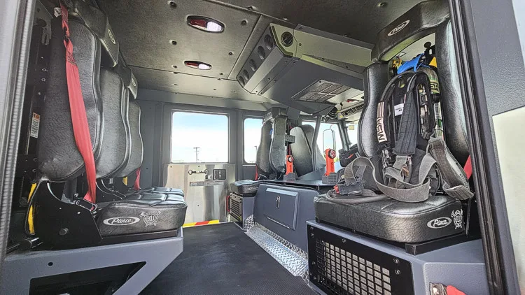 Cab interior view showing seat row, center aisle, and dash area