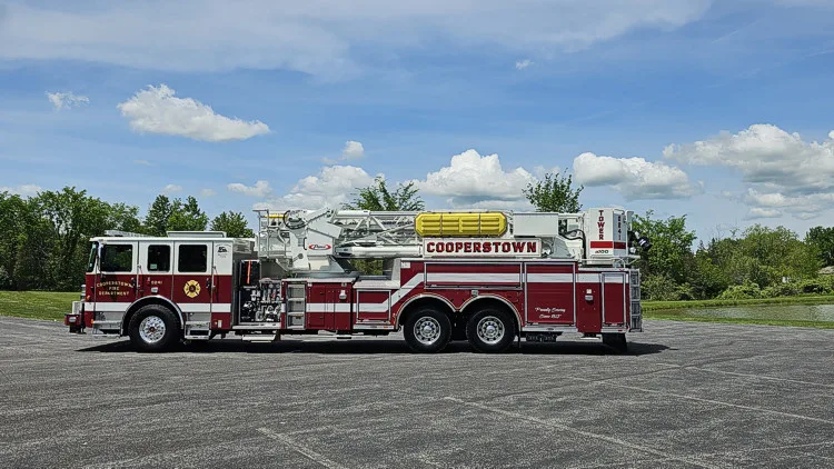 Aerial ladder truck side profile view showing full body and ladder sections