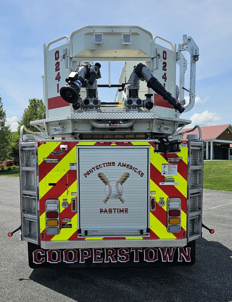 Rear view showing chevrons, rear lights, and bucket at the ladder tip