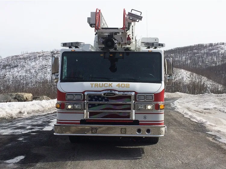 Front exterior view showing grille, bumper, and elevated platform structure