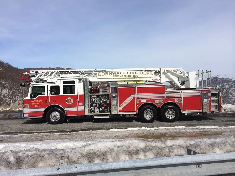 Driver-side profile with open pump panel showing gauges and controls