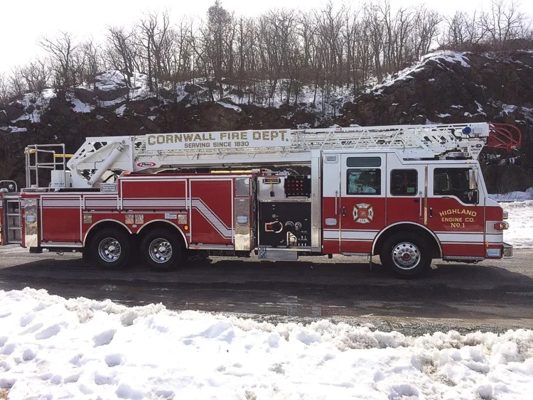 Passenger-side full profile showing ladder sections and side body