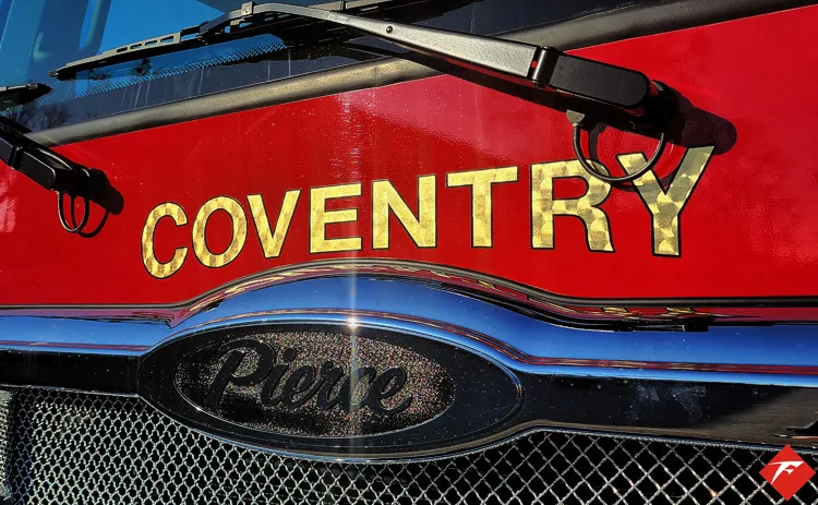 Front grille close-up showing Coventry script and Pierce badge