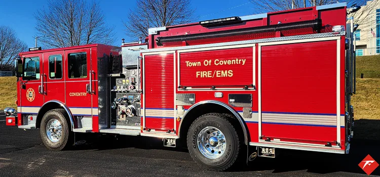 Driver-side profile view showing pumper body and side compartments