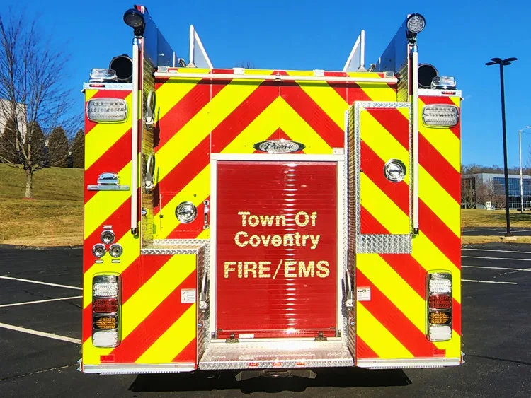 Rear view showing red-and-yellow chevrons and center rear panel