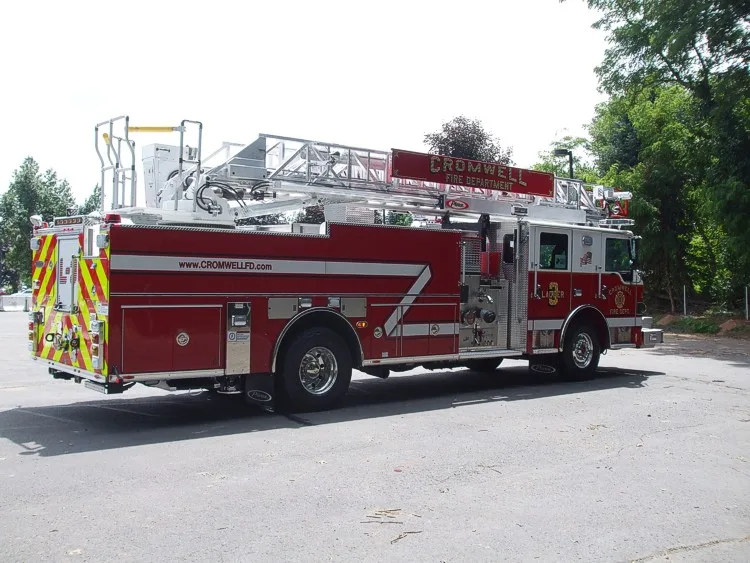 Rear-left exterior view showing rear body and side warning striping