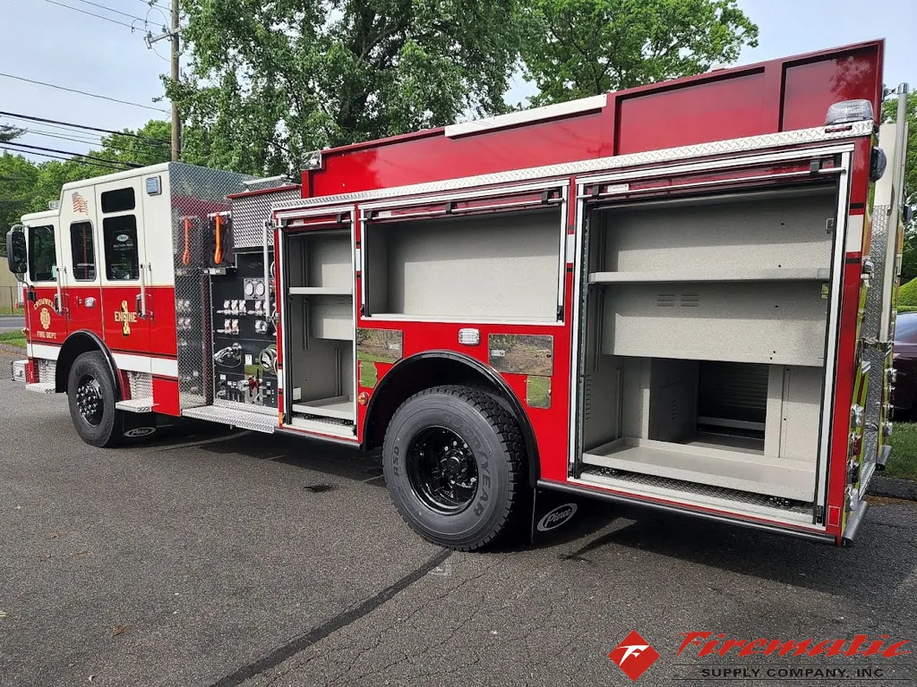 Driver-side profile with open compartments showing shelves and pump controls