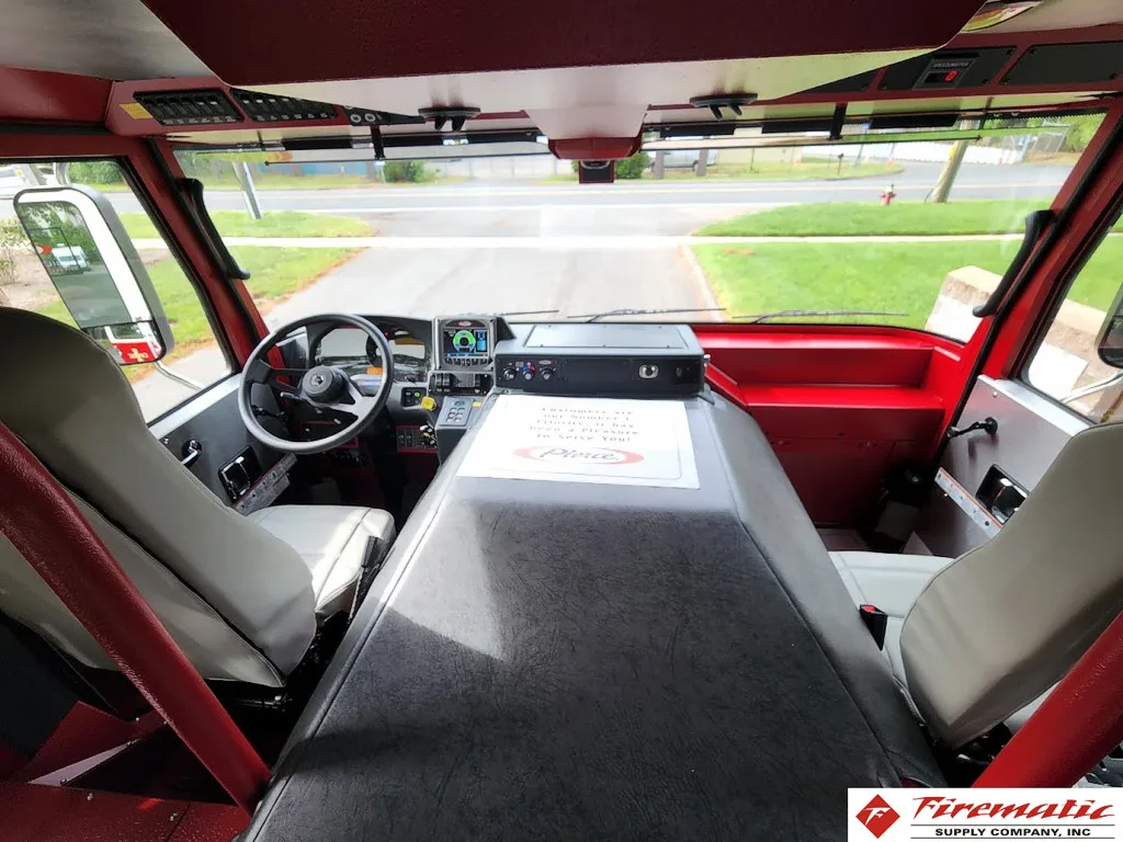 Front cab interior view showing center console, dashboard, and windshield view