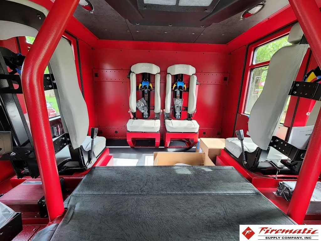 Rear crew cab interior view showing bench seats and seat mounts