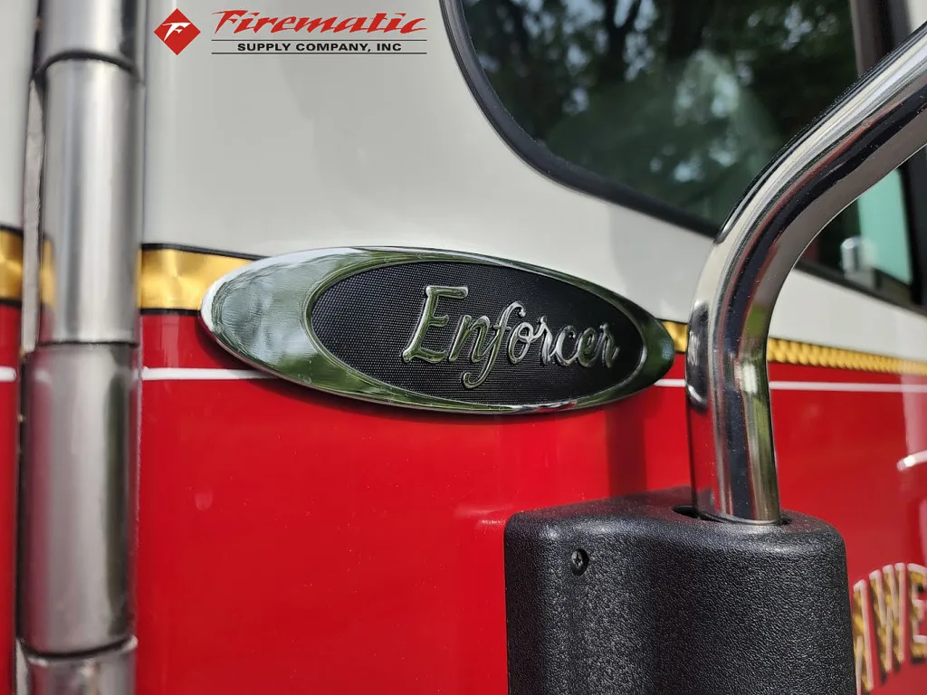 Body badge close-up showing Enforcer model emblem