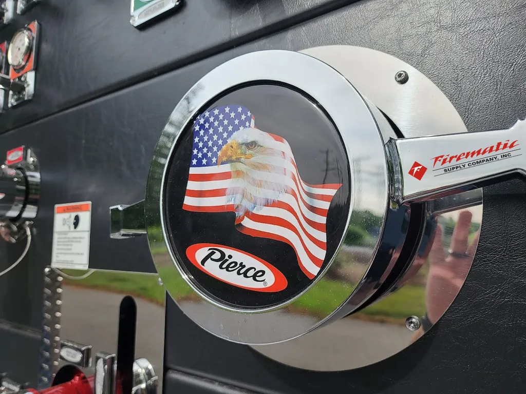 Pump-side panel close-up showing circular emblem and trim ring