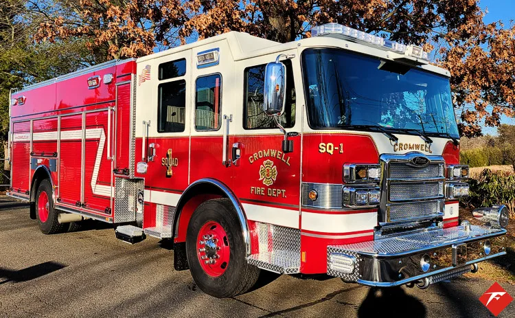 Rescue pumper front-left exterior view parked under trees