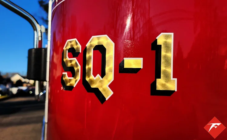 Body panel close-up showing raised unit number lettering