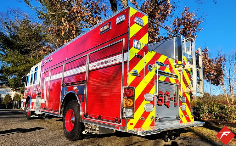 Rear-right exterior view showing rescue body and chevron-striped tail