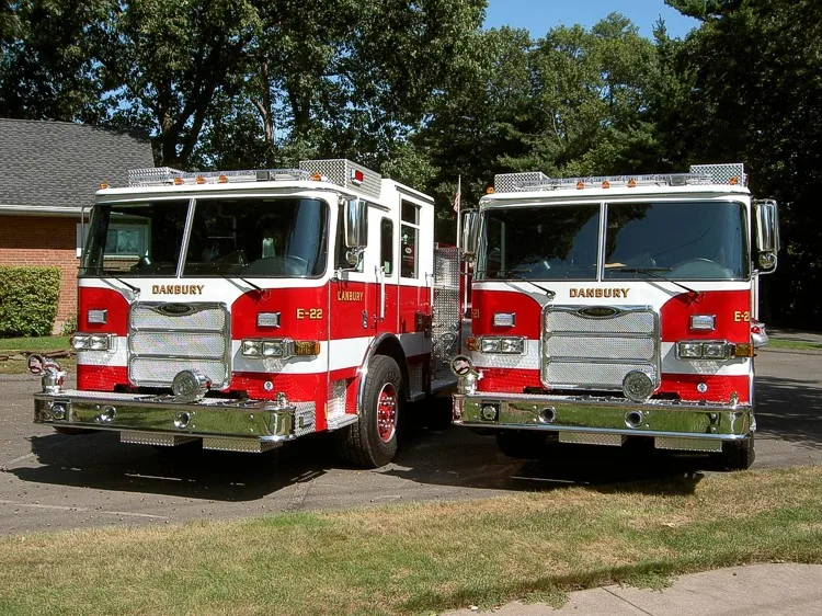 Front view of two apparatus showing grilles and warning lights