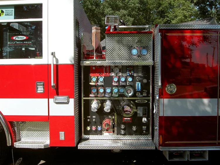 Pump panel close-up showing gauges, valves, and control levers