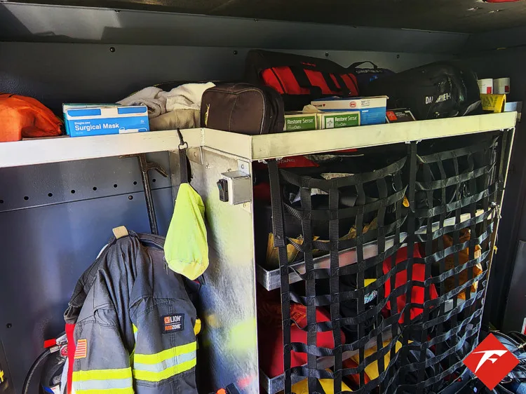 Open side compartment showing hanging gear and shelf storage bins