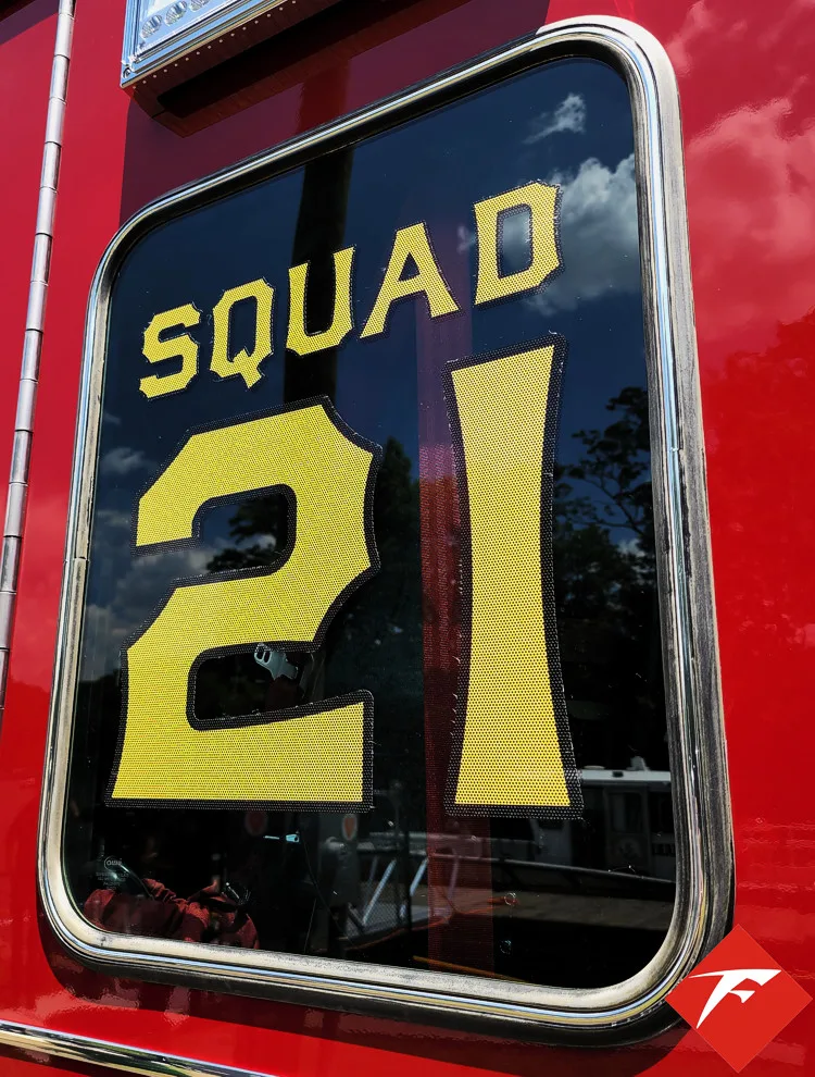Body emblem close-up showing squad unit crest on red panel