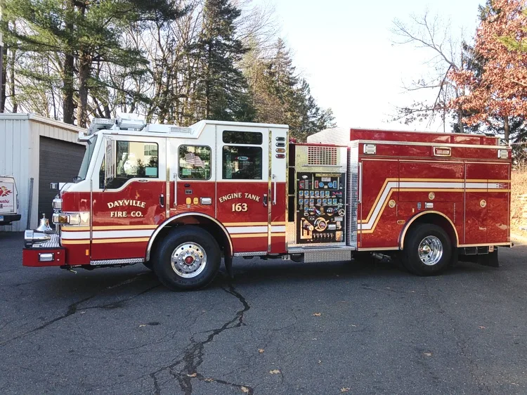 Driver-side profile with open pump panel showing gauges and controls