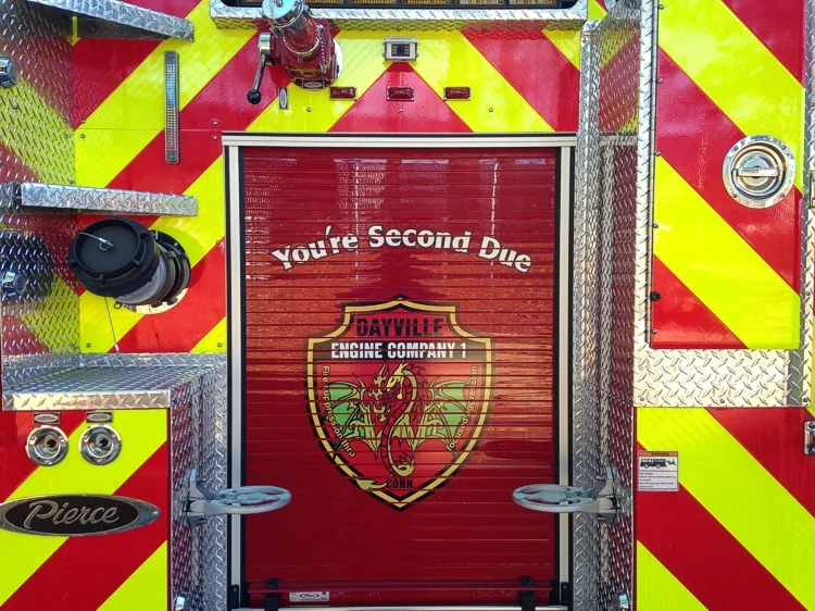 Rear-panel close-up showing chevrons and center logo on rear door