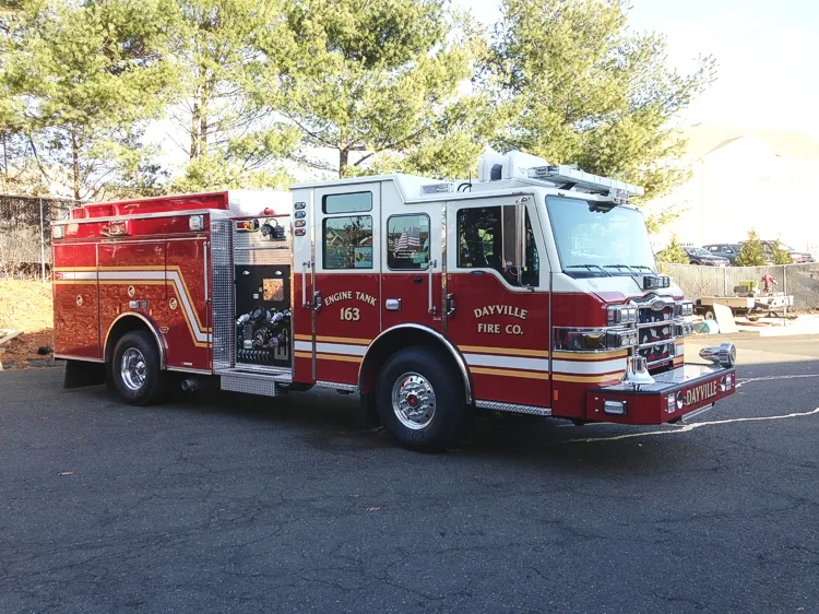 Front-right exterior view showing side compartments and wheel area