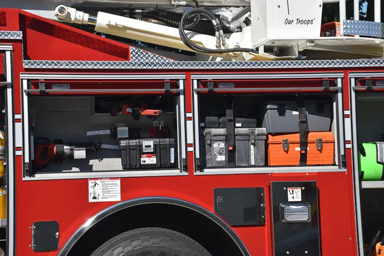 Mid-body compartment close-up showing open storage bays and mounted gear