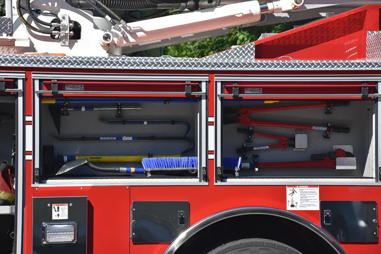 Open side compartment showing shelf storage and equipment bins