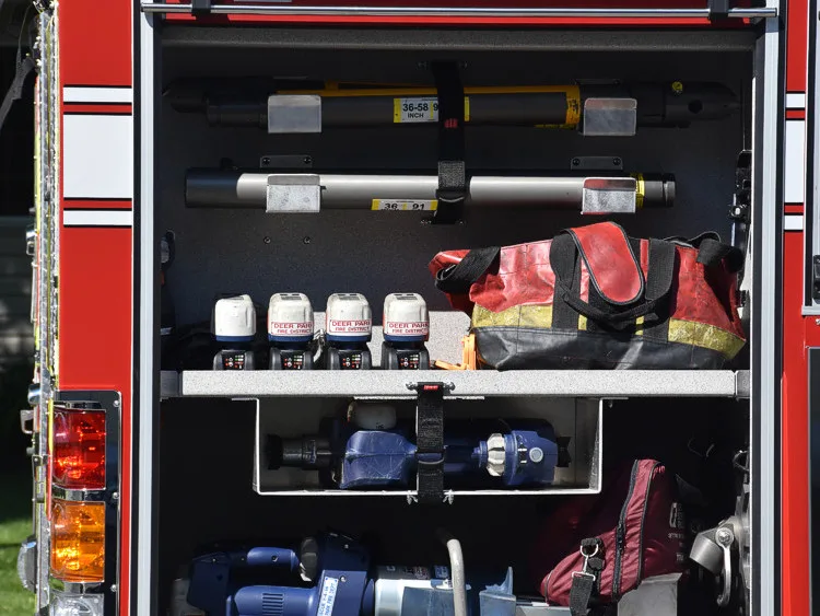 Open side compartment showing shelf bins and organized tool storage
