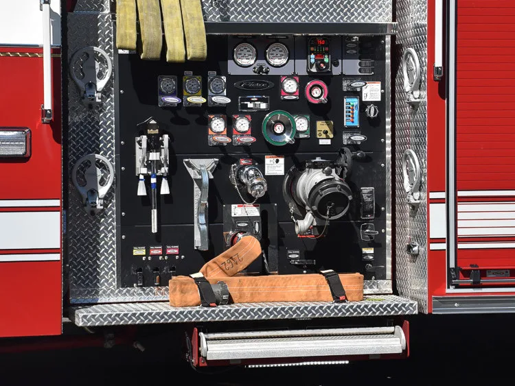 Pump panel close-up showing gauges, valves, and control handles