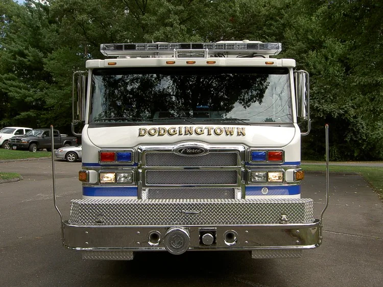 Front exterior view showing grille, bumper intake, and warning lights