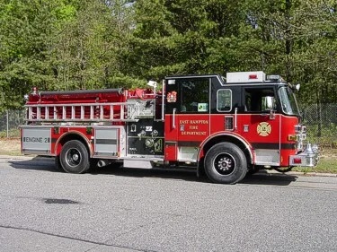 Driver-side profile with open pump panel showing gauges and controls