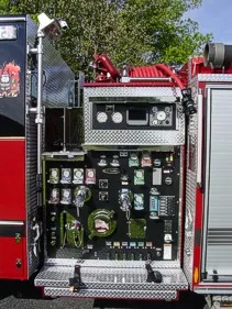 Front exterior view showing grille, bumper, and warning lights