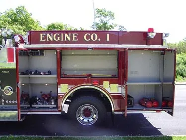 Driver-side profile with open compartments showing side storage bays