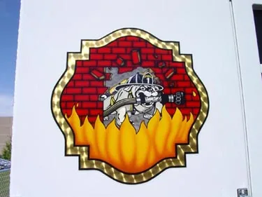 Cab door close-up showing shield-style station patch on white panel