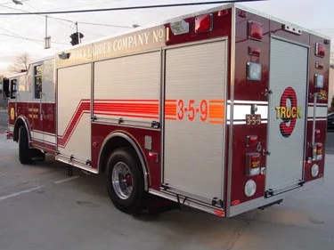 Rear-right exterior view showing side compartments and rear body panel