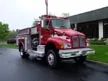Pumper front-left exterior view showing commercial-style cab and side compartments
