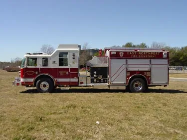 Driver-side profile showing pump panel area and side body compartments