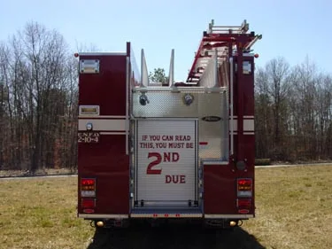 Rear view showing rear panel, warning lights, and hosebed divider fins