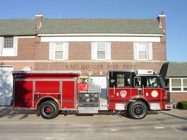 Full right-side profile showing side compartments, midship pump panel area, and rear wheel section.